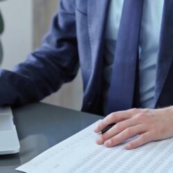 Accountant reviewing financial statements to reduce errors and prevent liability risks.