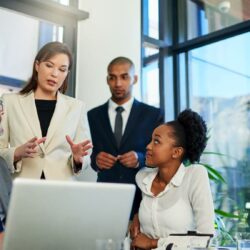 Law firm professionals using technology and standardized processes to improve efficiency and reduce professional liability risk