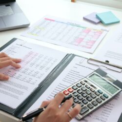 Accountant reviewing financial statements to reduce errors and prevent liability risks.