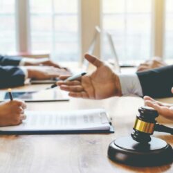 Attorney reviewing legal documents as part of a law firm's professional liability and risk management strategy