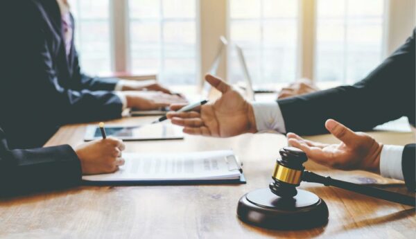 Attorney reviewing legal documents as part of a law firm's professional liability and risk management strategy