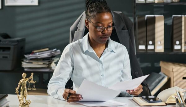 Small law firm attorneys reviewing client intake documents to prevent conflicts of interest