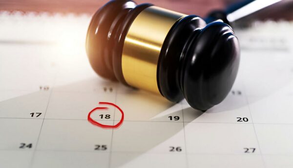 Attorney reviewing case deadlines on a centralized legal calendar to prevent missed filings.